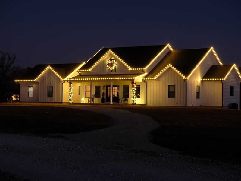Home exterior with professional holiday Christmas lights installation