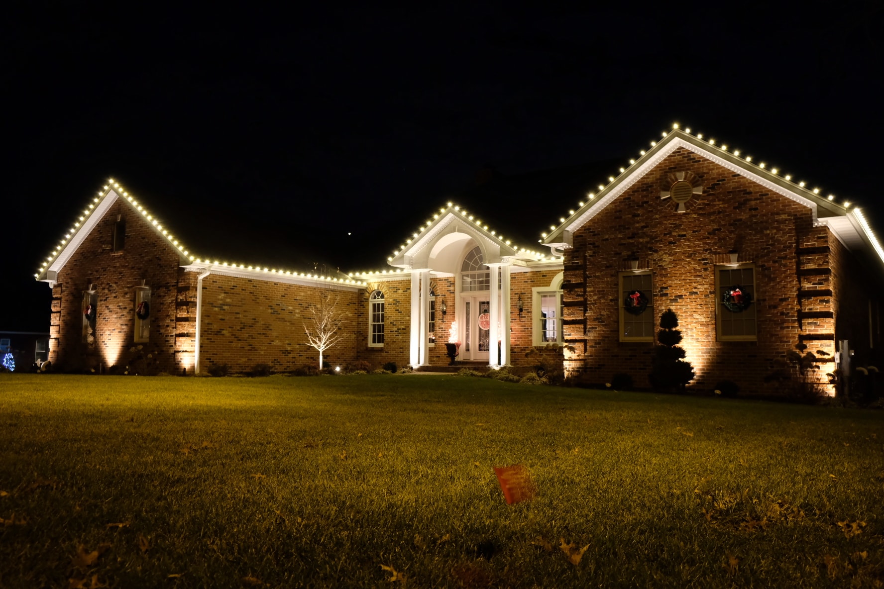 Bold holiday lighting statement on home exterior