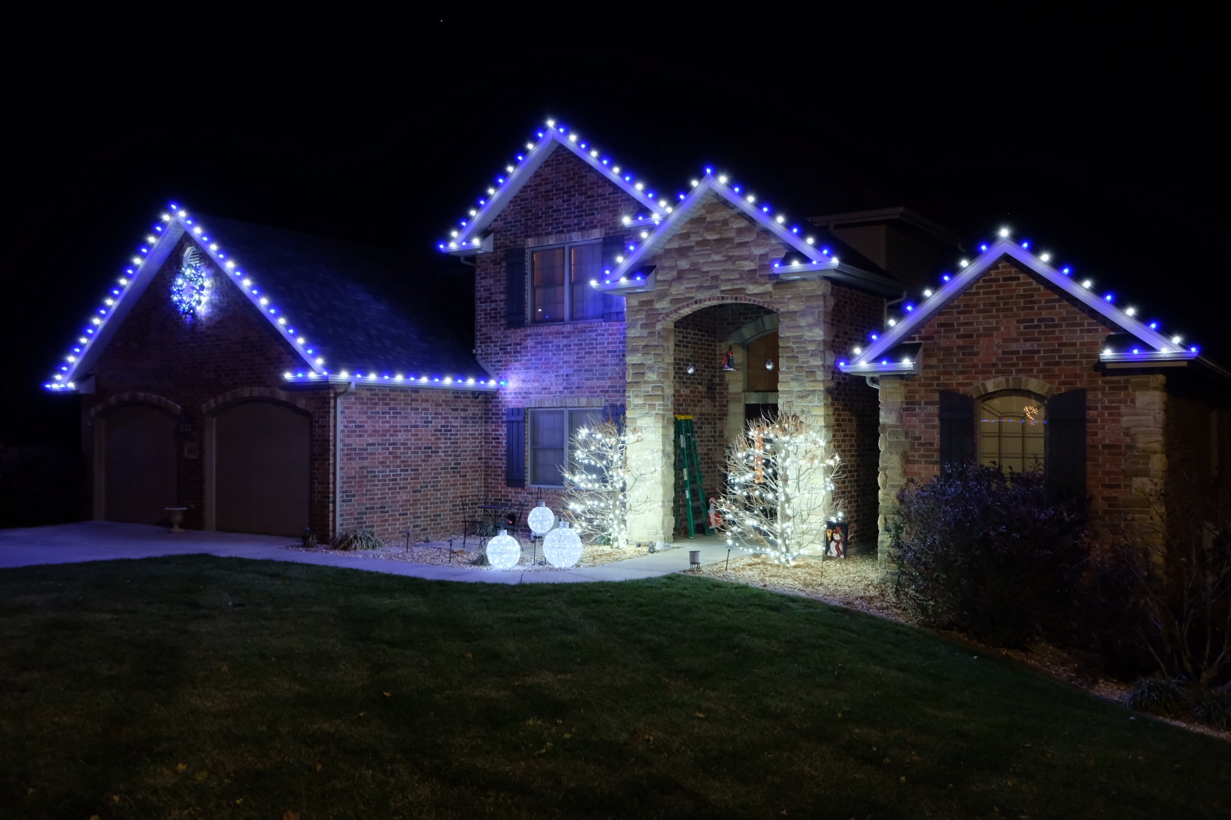 Festive front elevation holiday lighting on home