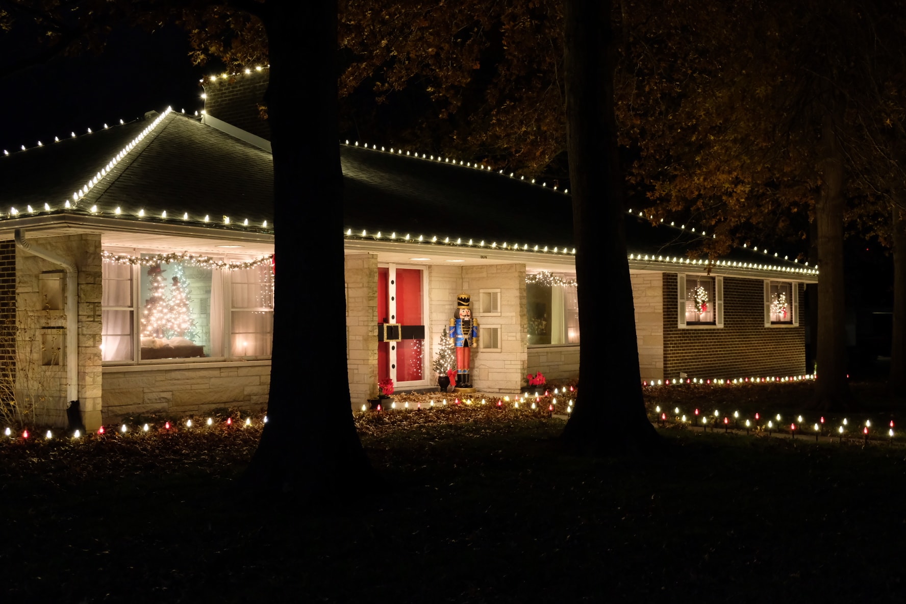 Complete holiday lighting package on home exterior
