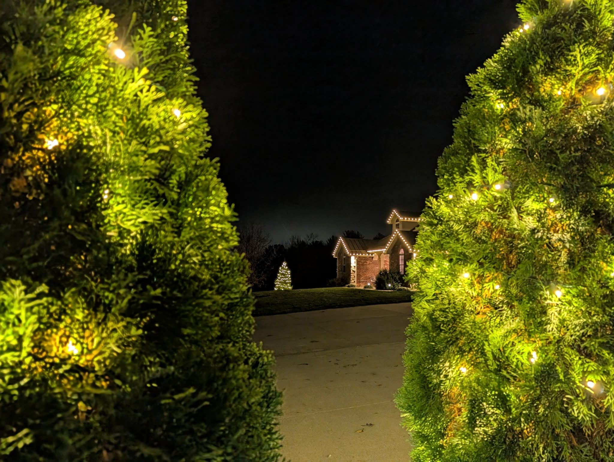 Home exterior with professional holiday lighting display