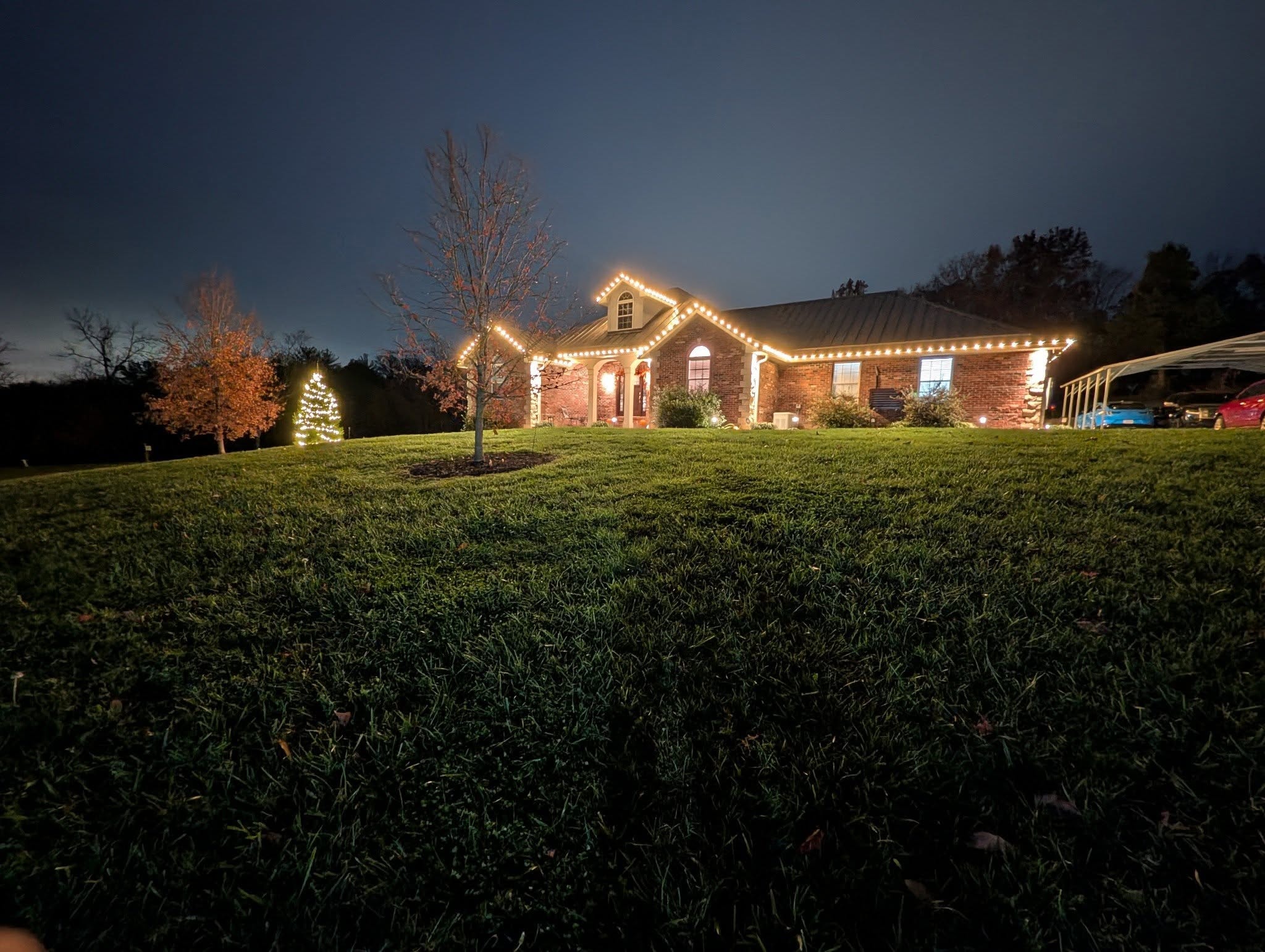 Home with holiday roofline and trim lighting
