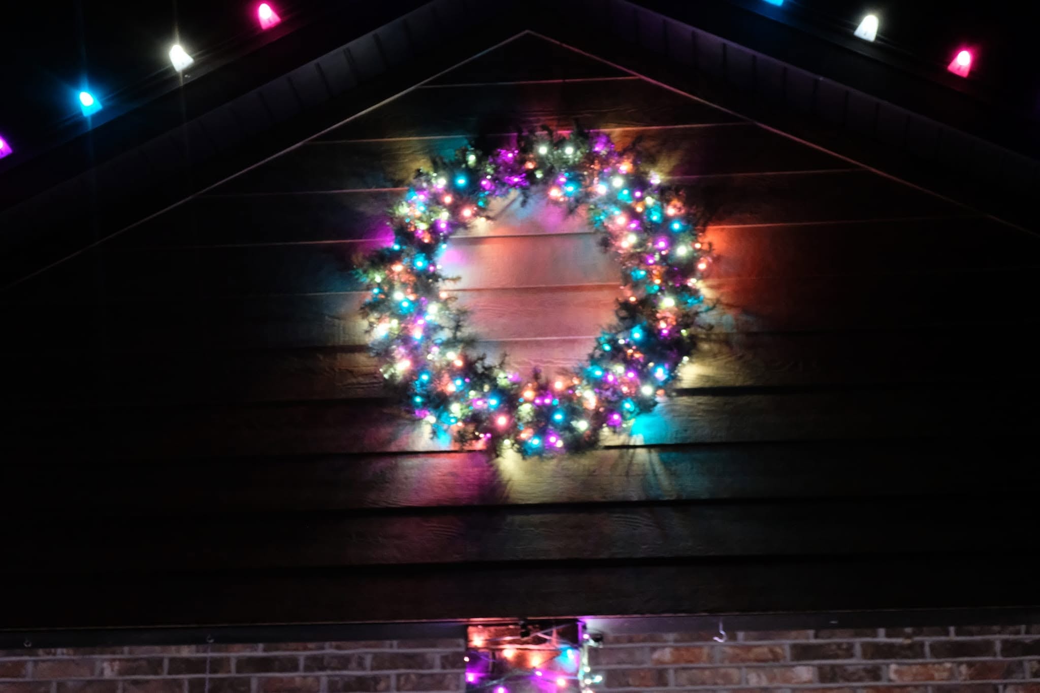 Home with classic holiday roofline lighting