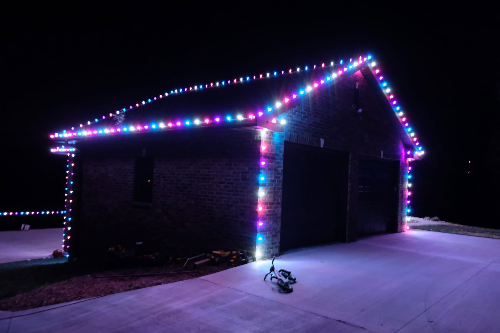 Home with warm white holiday trim lighting