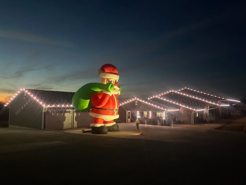 Full exterior holiday light display on home