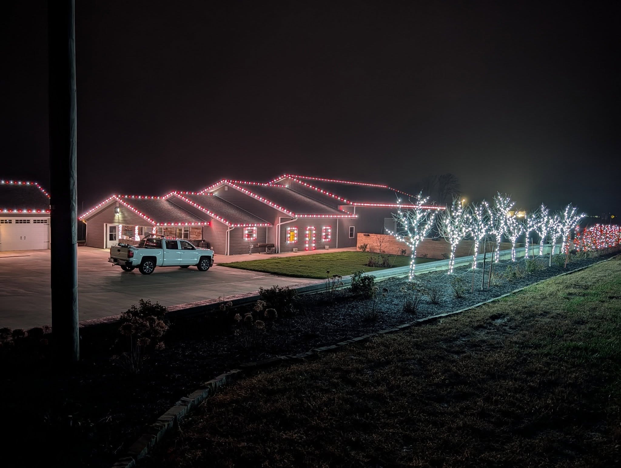 Winter holiday display lighting on home exterior