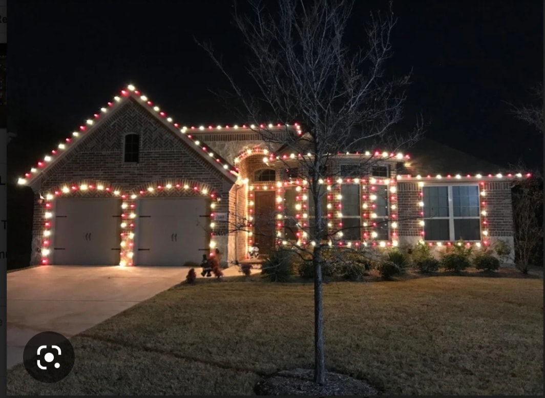 Home with holiday lights on roofline and wrapped columns