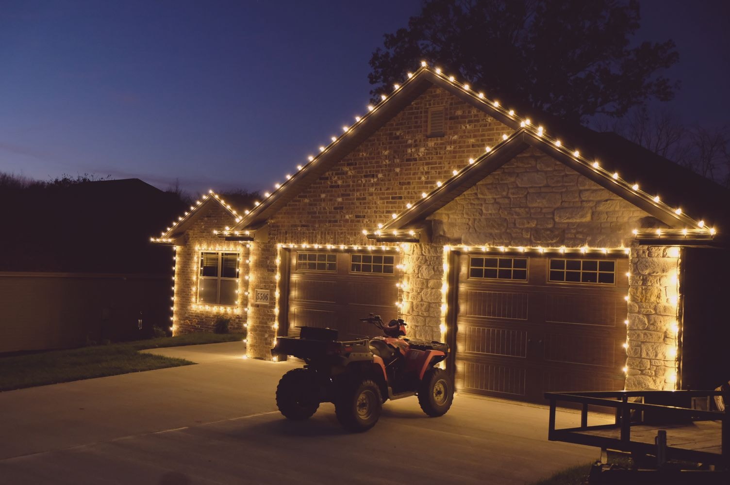 Complete holiday lighting transformation on home exterior